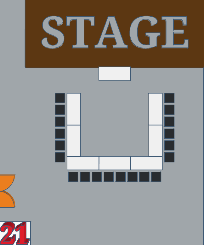 Tables and chairs in a U-shape with a stage at the front.