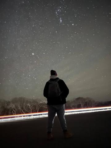 person stargazing