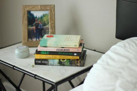 books on a bedside table