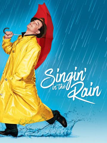 Gene Kelly holding an umbrella