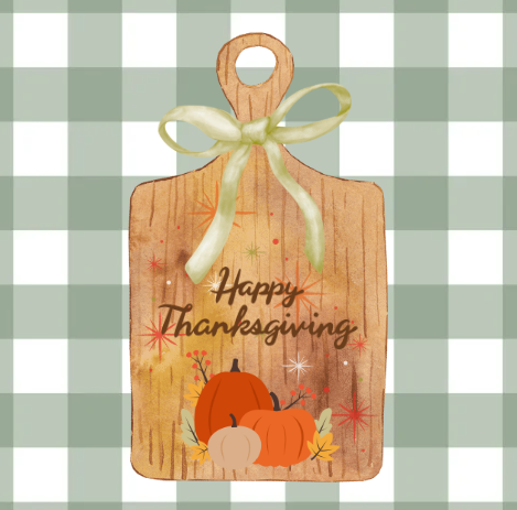 Wooden board with a bow that says "Happy Thanksgiving"