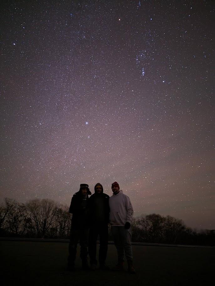 people gazing up at a starry sky