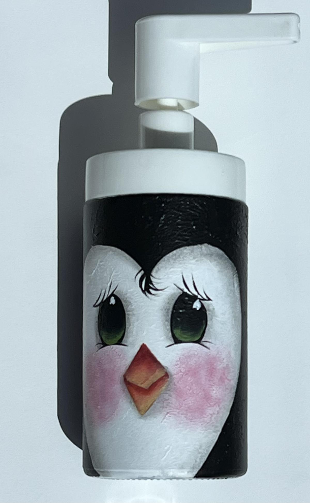 penguin painting on a soap dispenser