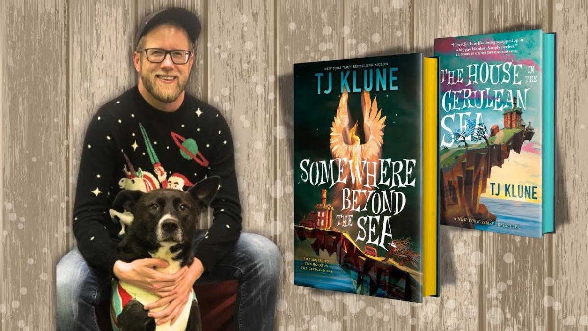 author TJ Klune with two of his novel's covers