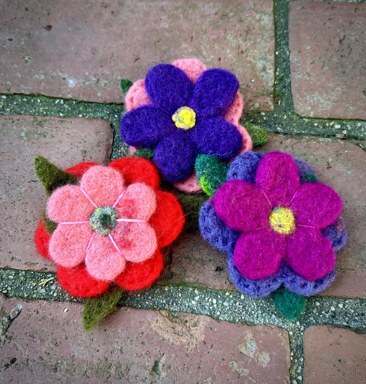 assorted color flowers made from felt