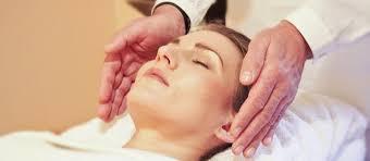 patron receiving reiki treatment