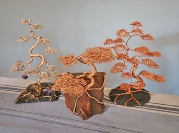 A set of three wire tree sculptures, created by Dave Prevete.